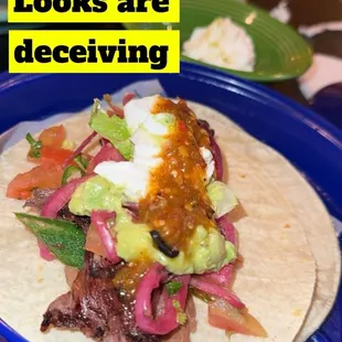 This is my state plate after I doctored it up with some pickled onions, guacamole sour cream, had to pay extra for hot salsa.