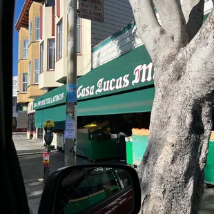 a tree in front of a store