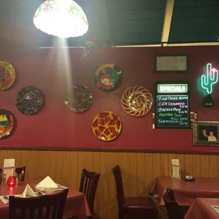 Dining room with specials on the wall.