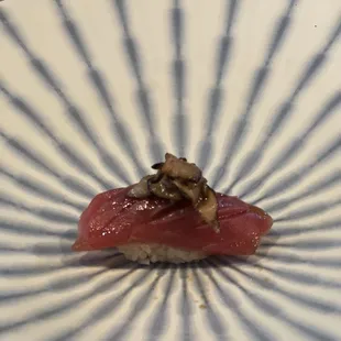 One of the most unique nigiri I&apos;ve ever had! Tuna with an almond was inside the rice &amp; mushrooms on top! Delicious!!!