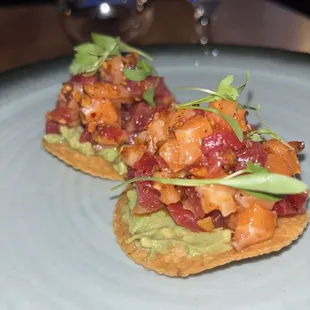 Sake maguro tostadas Salmon &amp; tuna marinated in salsa macha, on avocado laced tortilla