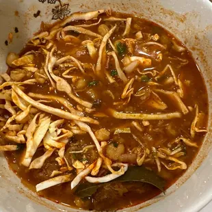 Pozole. Not spicy but has a lot of spice. Wish they served it with tortillas.
