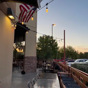 a man sitting at a table outside