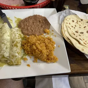 Enchiladas verdes and homemade flour and corn tortillas.