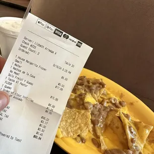 $18.00 bean and cheese nachos.