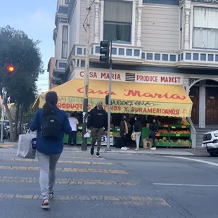 a woman walking across the street