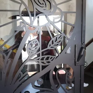 a close up of a decorative glass door