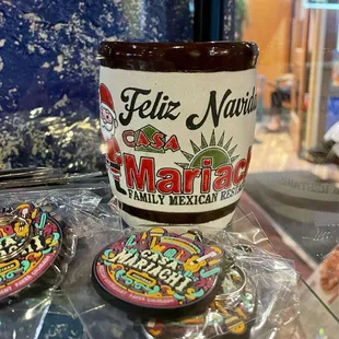Feliz Navida mug cup is color (for sale at the merch section)