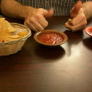 Chips and salsa. Mild in the brown bowl. We prefer the hot.