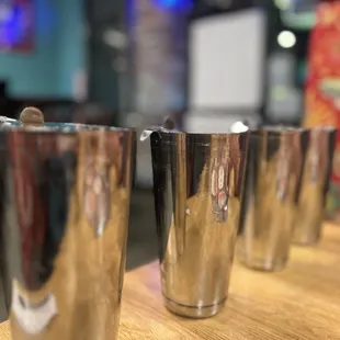 a row of silver cups