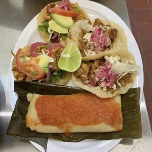 Chicken and cochinita salbutes with a chicken tamale