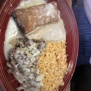 Tamale, potatoes, and a chicken enchilada.