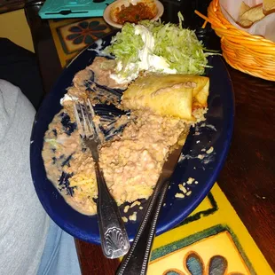 a plate of food and utensils