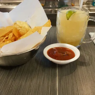 a bowl of chips and a bowl of salsa