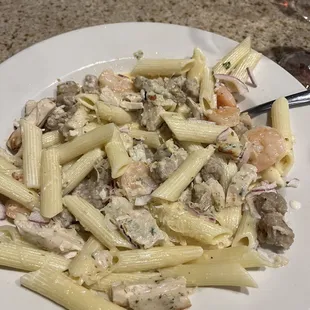 a plate of pasta with shrimp and shrimp