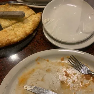 a dirty plate with a knife and fork