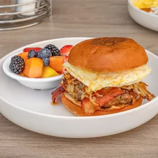 Breakfast Burger.
Beef and Chorizo patty, crispy Hash brown, American cheese, bacon, eggs any style and a side of fresh fruit.