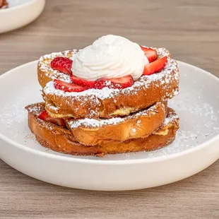 Churro French Toast. 
Double dipped golden brown churro French toast topped with strawberries and our homemade whipped cream.