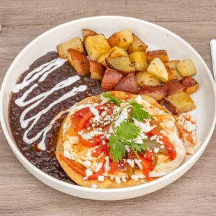 Huevos Rancheros.
Two eggs any style on top of a fried tortilla, refried beans on the side, with our special house sauce.