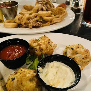 Crispy fresh fried calamari in the background. They're delish full of lump crab meat crab cakes.