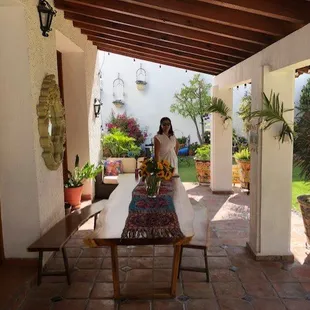 a woman standing in a patio area