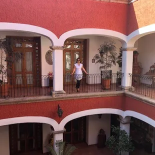 a woman standing on a balcony