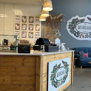 Menu is listed on the wall, she was also seen writing how many scoops were left of a particular flavor.