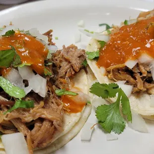 Tacos with carnitas.  The pork is moist and delicious!  (Yes, they do Taco Tuesdays.)