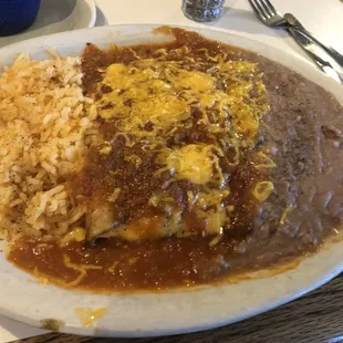 Cheese enchiladas with spicy rancheros sauce rice and beans
