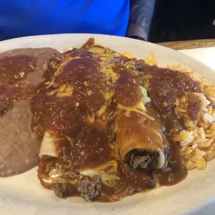 Beef enchiladas with chili con carne rice and beans
