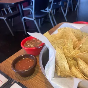 Complimentary chip and salsa, and beans soup