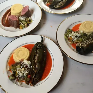 Stuffed poblano chile, corn flan &amp; calabacitas in romesco sauce.