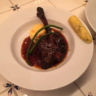 Lamb shank on creamy polenta with jus, asparagus and green chile corn bread.
