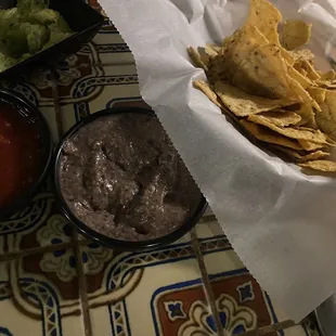 Chips with black bean salsa, house medium, and guacamole.  The guacamole is $5.....