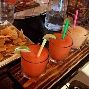 Raspberry, watermelon, and peach frozen margaritas.