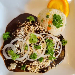 a plate of food with rice and vegetables