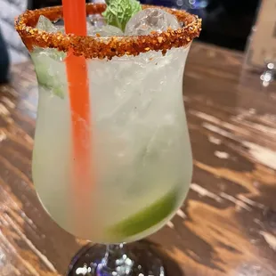 a margarita with a garnish on the rim