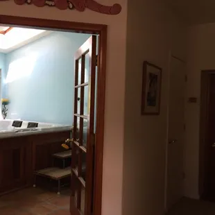 Entrance to indoor jacuzzi off Family Room and one of the doors to Mournjng Dove Suite.