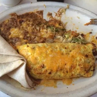 Great cheese omelette with green roasted chiles and chorizos served with tortilla and beans.