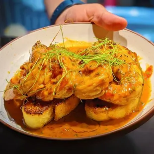 a person holding a plate of food