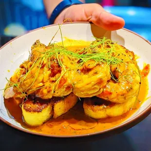 a person holding a plate of food