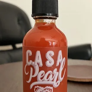 House-made hot sauce, available for purchase.