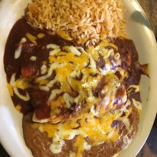 Mexican rice, cheese enchilada, pork tamale &amp;refried beans