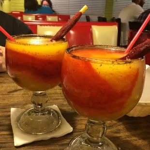 Mangonada w/ Tamarind stick. Chamoy too (red). Sweet, sour, spicy all in one