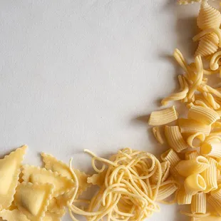 a pile of pasta on a white surface