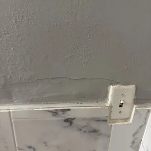 Walls cracking and repaired badly.