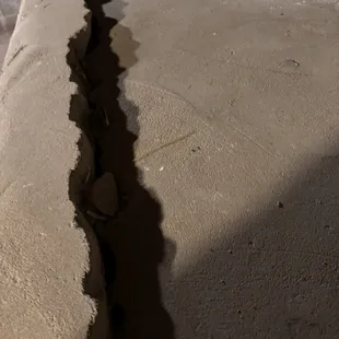 This was a small crack when we moved in. Sunk 3 inches and opened up.