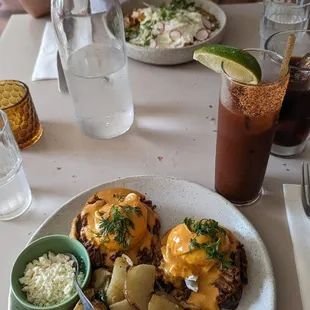 Eggs Benedict with barbacoa, Bloody Maria, chilaquiles