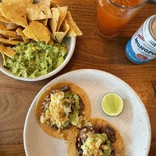 Guac &amp; chips, carnitas tacos