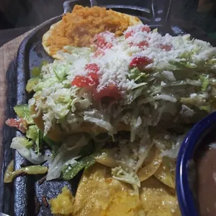 Green enchiladas with asada. Rice and beans